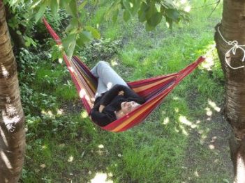 Student of Spanish course relaxing in hammock